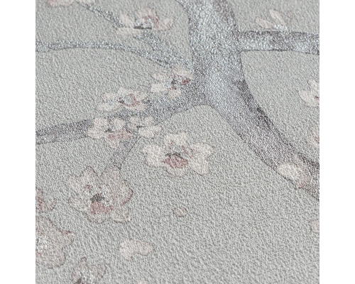 Papier peint intissé structuré avec motif floral de branches d arbres et de fleurs scintillantes.