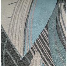 Papier peint intissé avec motif de feuilles abstrait et texture fine.
