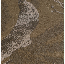 Gros plan d'un papier peint intissé structuré avec un motif abstrait scintillant.