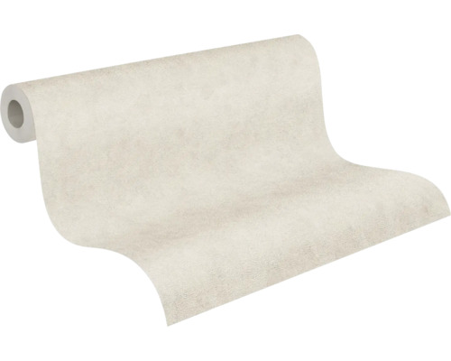 Rouleau de papier peint légèrement texturé en beige clair avec aspect crépi.
