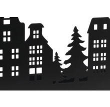 Silhouette noire d une rangée de maisons avec des sapins pour la décoration.