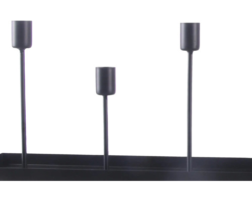 Bougeoir en métal noir avec trois supports à différentes hauteurs sur une base rectangulaire.