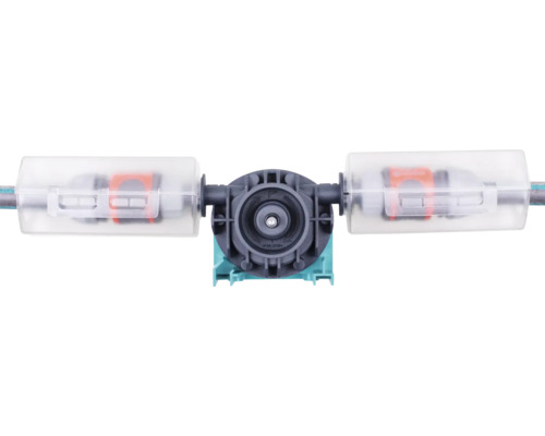 Accessoire pour arrosage avec unité de pompe ronde et deux couvercles en plastique transparent pour les raccords de tuyau.