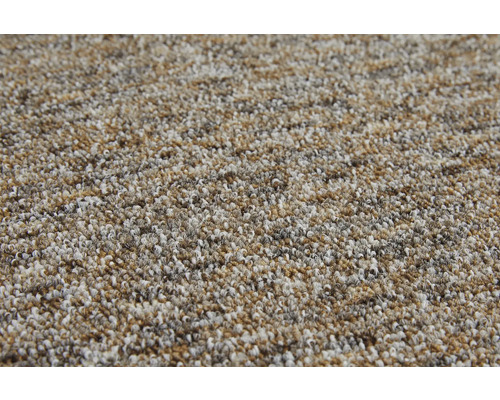 Vue détaillée d'une moquette bouclée chinée avec une surface texturée.