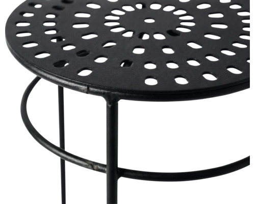 Tabouret en métal avec plateau perforé rond et structure noire.