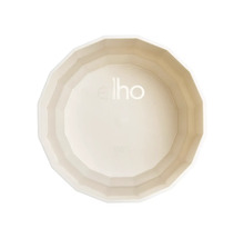 Soucoupe elho en plastique pour pots de fleurs, blanc crème, forme ronde avec intérieur facetté.