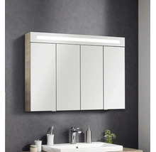Badezimmer-Spiegelschrank mit vier Türen und integrierter LED-Beleuchtung, montiert über einem weißen Waschbecken.