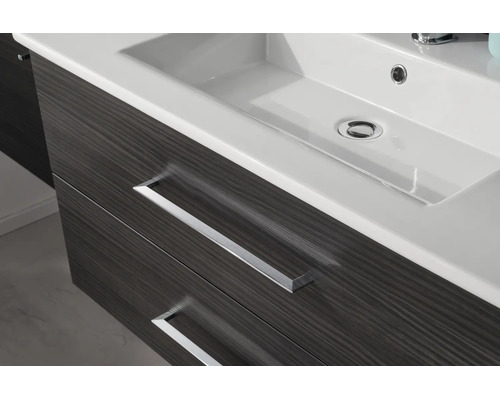 Meuble sous-vasque avec deux tiroirs aspect bois et lavabo en céramique blanche.
