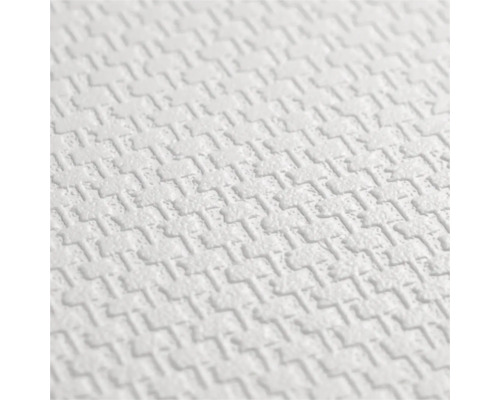 Papier peint structuré avec un motif géométrique en relief.