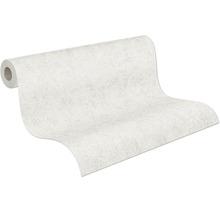 Rouleau de papier peint intissé structuré avec un motif marbré.