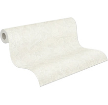Papier peint texturé avec effet crépi sur un rouleau.
