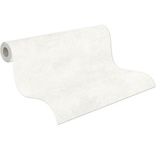 Papier peint intissé structuré en rouleau, partiellement déroulé.