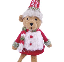 Ours en peluche comme décoration de Noël avec pull en tricot rouge, écharpe et bonnet.