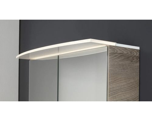 Armoire de toilette avec éclairage LED supérieur et corps aspect bois.