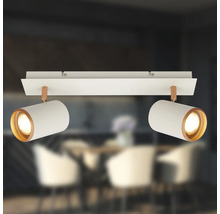 Plafonnier à deux spots en métal blanc avec des accents de cuivre et têtes orientables.
