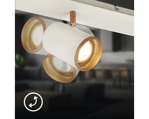 Spot de plafond orientable et inclinable blanc et cuivre pour systèmes de rails. Un symbole indique la mobilité du luminaire.