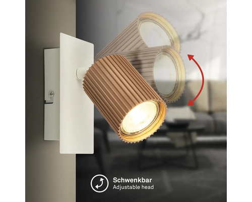 Applique murale avec tête de spot orientable aspect bois et support blanc.