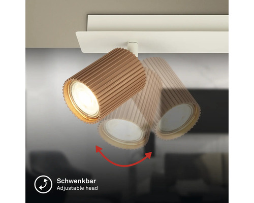 Tête de spot de plafond orientable avec une structure nervurée.