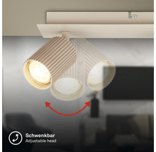 Plafonnier orientable avec spot au design rainuré.
