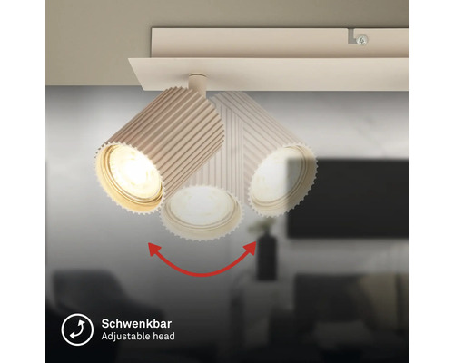 Plafonnier orientable avec spot au design rainuré.