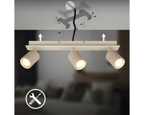 Plafonnier avec trois spots orientables et schéma de montage au plafond avec support et vis.