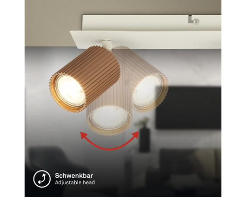 Spot de plafond avec tête orientable et rainurée, aspect bois.