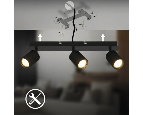 Plafonnier noir à trois spots avec instructions de montage au plafond et symbole d'outil.