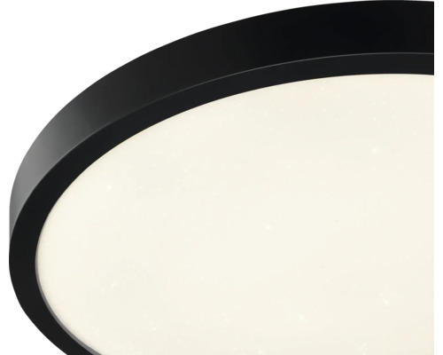 Détail d'un plafonnier LED rond avec bord noir et effet ciel étoilé.