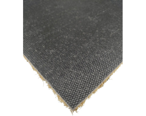 Vue détaillée de l'envers antidérapant d'un paillasson en coco avec une surface texturée.