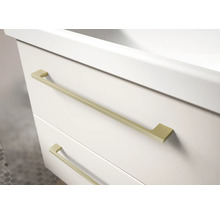 Meuble sous-vasque blanc avec deux tiroirs et fines poignées en métal doré.