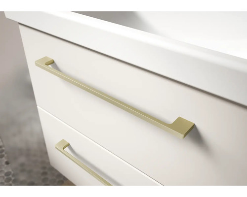 Meuble sous-vasque blanc avec deux tiroirs et fines poignées en métal doré.