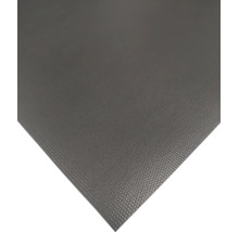 Gros plan d'un film plastique texturé ou d'un tapis de protection.