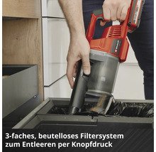 Aspirateur à main sans fil Einhell vidé d'une simple pression sur un bouton au-dessus d'une poubelle.