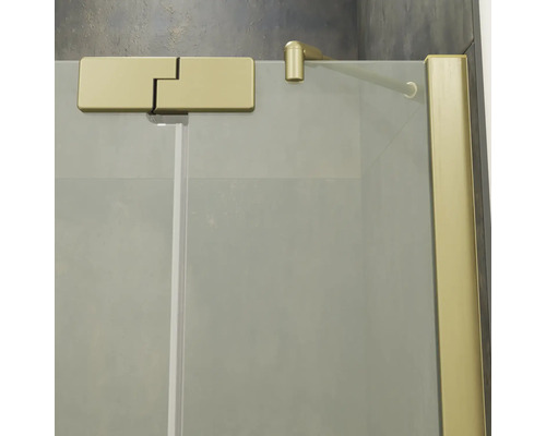 Paroi de douche en verre avec profilé charnière et barre de stabilisation dorés pour montage mural.