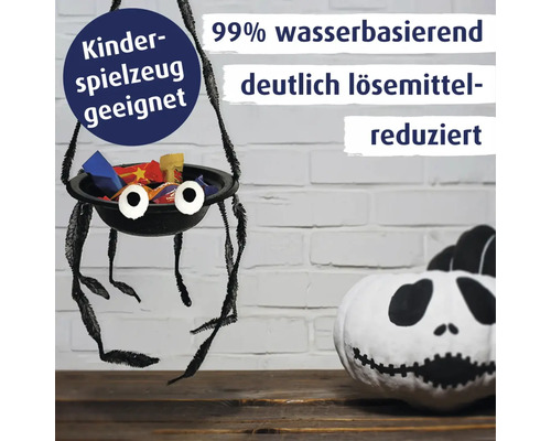Spinnenkorb aus Lack für Kinder mit Süßigkeiten und bemalter Kürbis mit Hinweisen zu Eignung für Kinderspielzeug und reduziertem Lösemittelgehalt