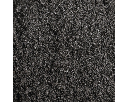 Gros plan de gravillons ou de granulés foncés à grain fin, en tant que texture de matériau.