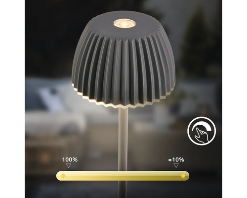 Lampe de table LED dimmable avec abat-jour nervuré et capteur tactile pour un réglage continu de la luminosité de 10 à 100 pour cent.