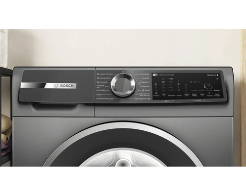 Panneau de commande d'un lave-linge séchant Bosch Série 6 avec bouton rotatif et affichage numérique.