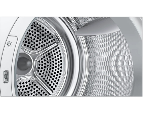 Vue détaillée du tambour en acier inoxydable d un sèche linge avec surface perforée et aubes de brassage.
