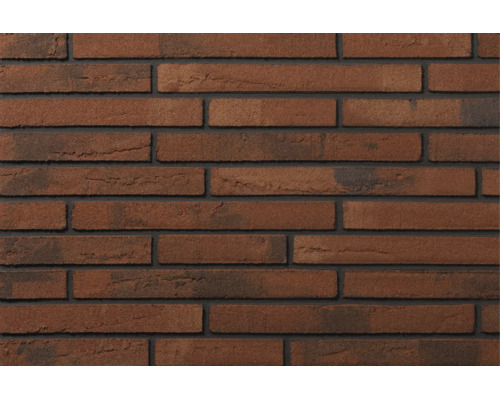 Mur en briques texturées avec des briques rustiques et des joints foncés disposées en appareil