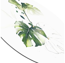 Nahaufnahme eines Tisches mit einem Monstera-Blattmotiv