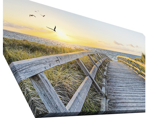 Toile décorative représentant une passerelle en bois menant à la plage au coucher du soleil