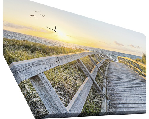 Impression sur toile avec une passerelle en bois menant à la mer au coucher du soleil