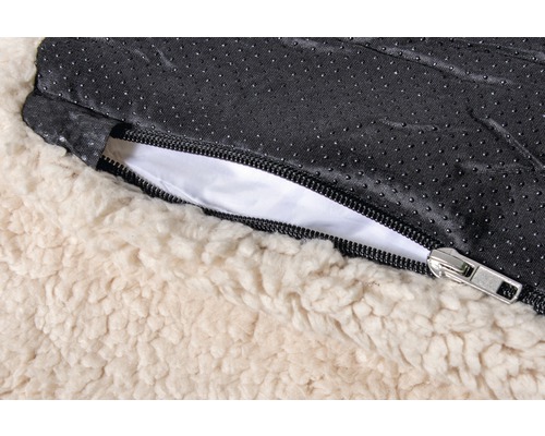 Vue détaillée d''un lit pour chien avec fermeture éclair et peluche nounours