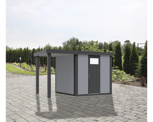 Abri de jardin avec extension sur une surface pavée