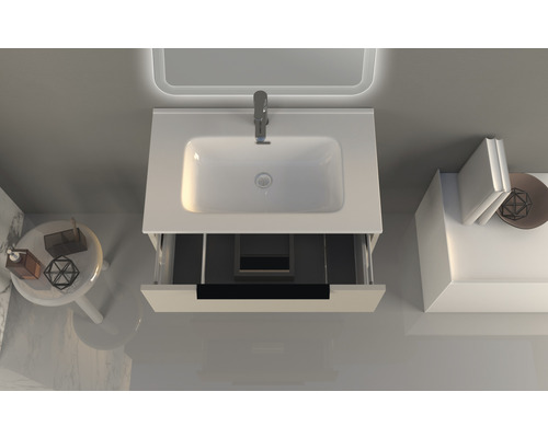 Meuble-lavabo de salle de bains avec tiroir ouvert, vasque à poser et robinet vus de dessus