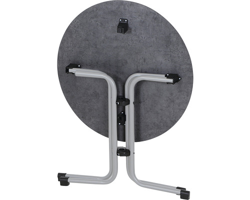 Table pliante ronde repliée avec plateau et structure en métal