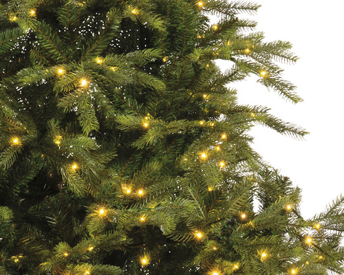 Gros plan d'un arbre de Noël avec des lumières