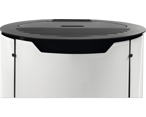 Oberer Teil eines Badezimmerschranks mit einer runden, dunklen Abdeckung