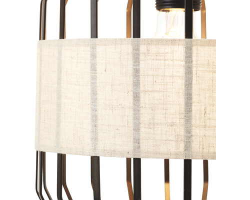 Vue détaillée d''une lampe avec abat-jour en tissu et structure métallique